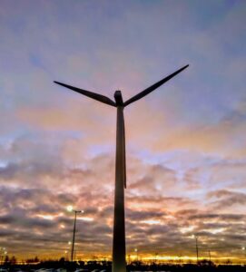 Image of a windmil against sky at dawn